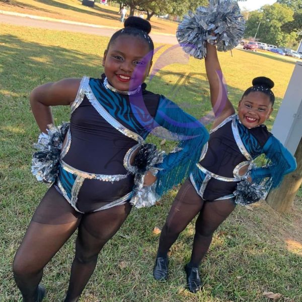 Stylish red and white majorette uniform with sequin details and pleated skirt.