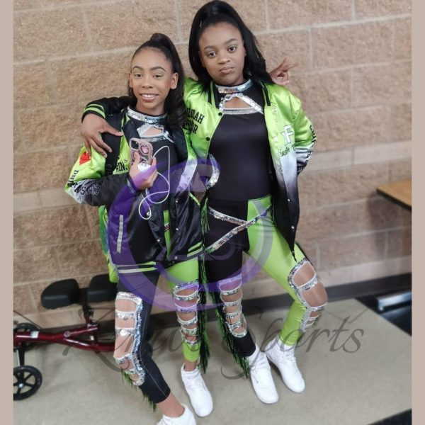 Stylish red and white majorette uniform with sequin details and pleated skirt.