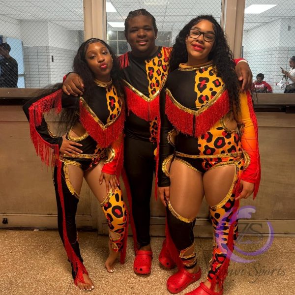 Stylish red and white majorette uniform with sequin details and pleated skirt.