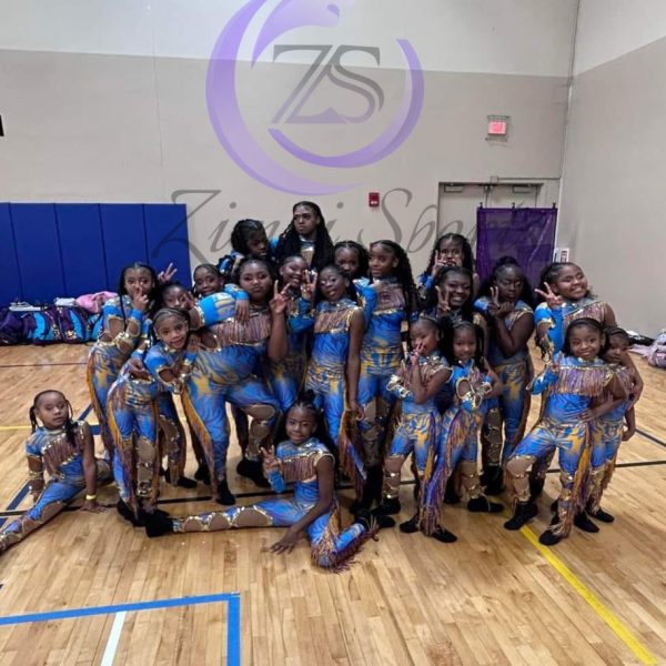 Stylish red and white majorette uniform with sequin details and pleated skirt.