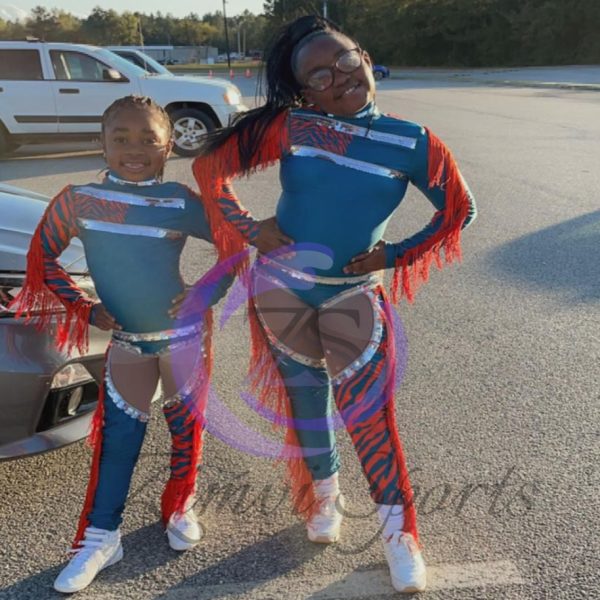 Stylish red and white majorette uniform with sequin details and pleated skirt.