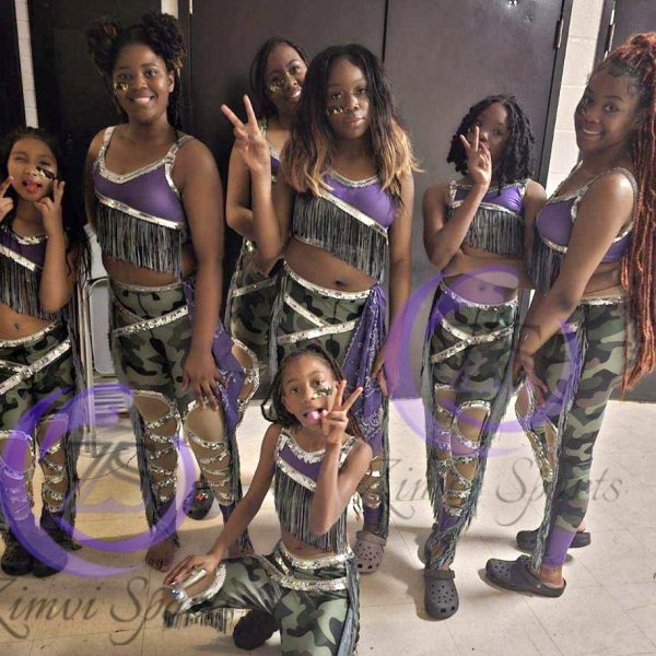 Stylish red and white majorette uniform with sequin details and pleated skirt.