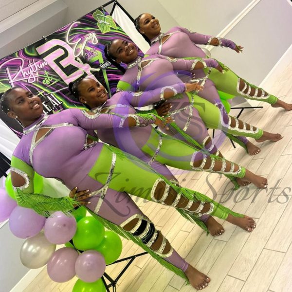 Stylish red and white majorette uniform with sequin details and pleated skirt.