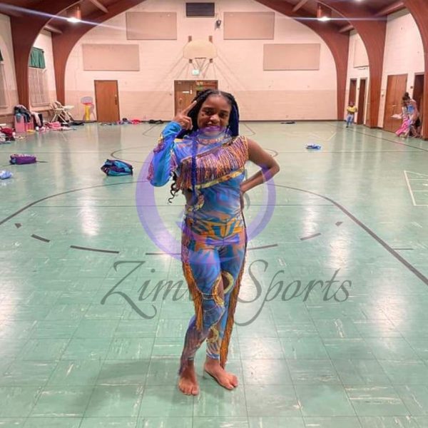 Stylish red and white majorette uniform with sequin details and pleated skirt.
