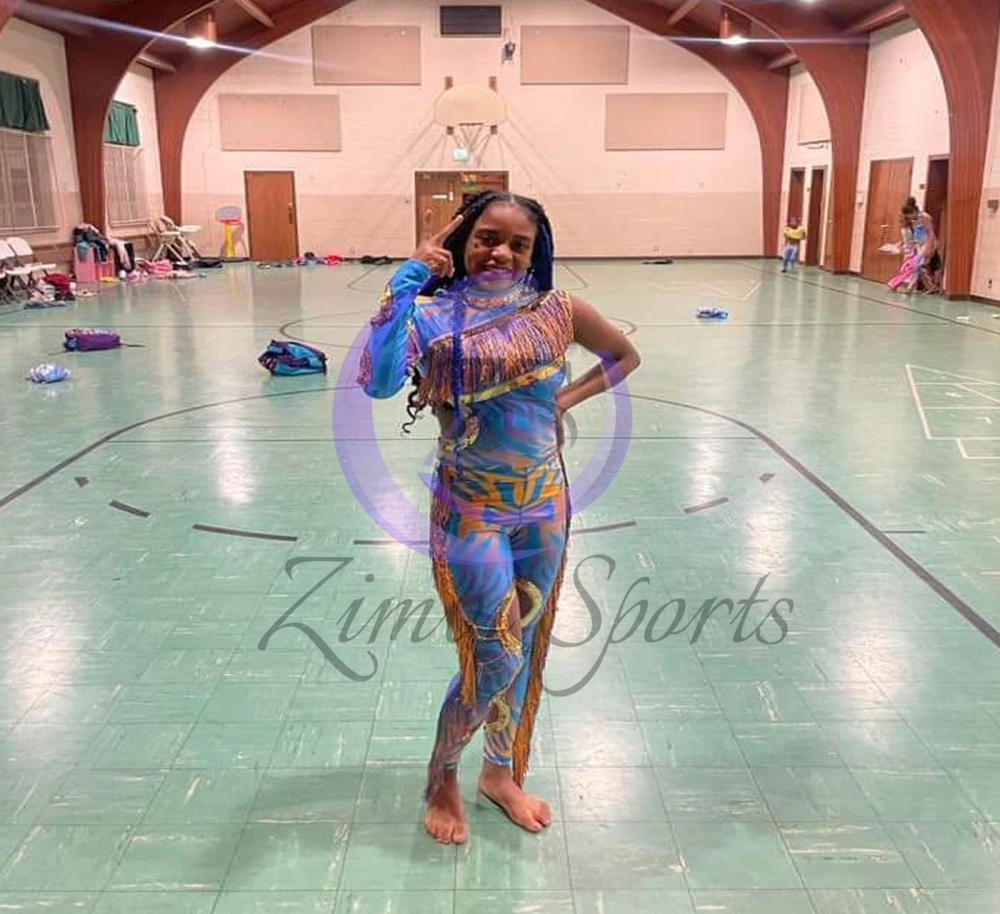 Stylish red and white majorette uniform with sequin details and pleated skirt.