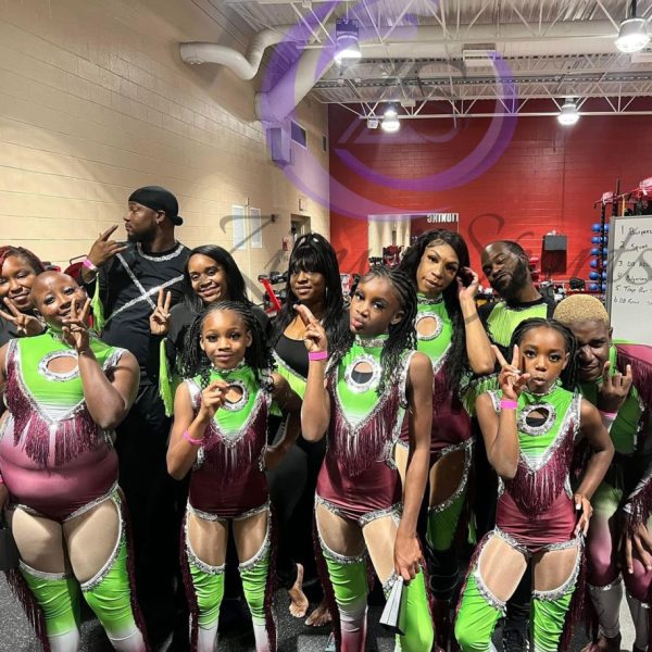 Stylish red and white majorette uniform with sequin details and pleated skirt.