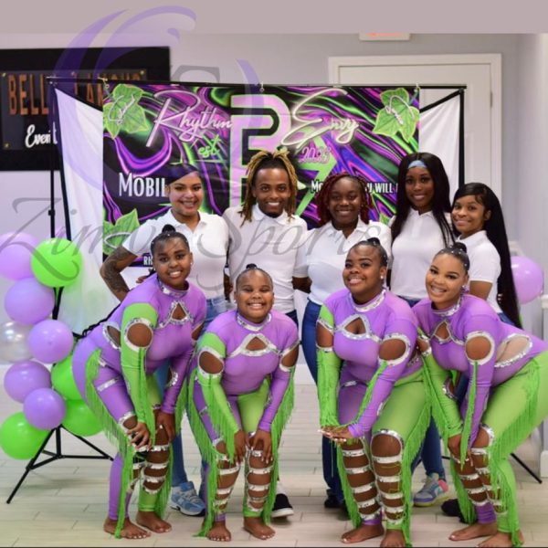 Stylish red and white majorette uniform with sequin details and pleated skirt.
