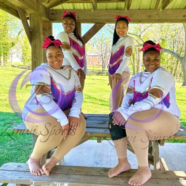 Stylish red and white majorette uniform with sequin details and pleated skirt.